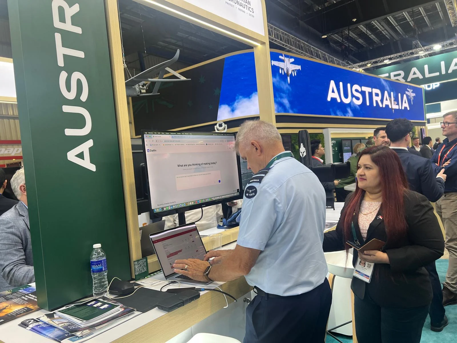 A visitor exploring the platform at the Dalfin AI exhibition space.